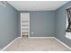 Bedroom with closet, window, grey walls, and carpet at 2622 Ethel Ave, Indianapolis, IN 46208