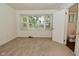 Bedroom with neutral carpet, window view, and a bathroom attached to the side at 2622 Ethel Ave, Indianapolis, IN 46208
