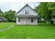 Charming home featuring a covered front porch and a well-maintained grassy lawn at 2622 Ethel Ave, Indianapolis, IN 46208