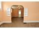 Neutral colored living room showcasing archway detail and carpet flooring at 2622 Ethel Ave, Indianapolis, IN 46208
