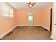 Bright living room showcasing window, ceiling fan, and carpet flooring at 2622 Ethel Ave, Indianapolis, IN 46208