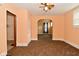Spacious living room with archway detail and carpet flooring throughout at 2622 Ethel Ave, Indianapolis, IN 46208