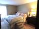 Comfortable bedroom featuring a large bed and soft lighting for a relaxing atmosphere at 2931 Eagles Crest Cir, Indianapolis, IN 46214