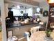 Eat-in kitchen featuring white cabinetry, a breakfast bar, and charming decor at 2931 Eagles Crest Cir, Indianapolis, IN 46214