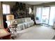 Cozy living room featuring a comfortable couch and bright, natural light from sliding doors at 2931 Eagles Crest Cir, Indianapolis, IN 46214
