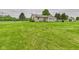 Lush backyard featuring a well-manicured lawn, storage shed, and partial fence line at 3387 S County Road 250 W, Danville, IN 46122