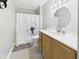 Bright bathroom featuring a vanity with white countertop and a tub with a stylish shower curtain at 3387 S County Road 250 W, Danville, IN 46122