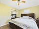 Well-lit bedroom featuring a mirrored closet door and ceiling fan at 3387 S County Road 250 W, Danville, IN 46122