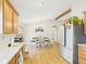 Open kitchen with wood cabinets, stainless steel appliances, and wood floors at 3387 S County Road 250 W, Danville, IN 46122