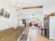 View of the open floor plan from the kitchen with living room and wood beam at 3387 S County Road 250 W, Danville, IN 46122