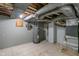 Exposed basement utilities include water heater, piping, and electrical at 3735 Marrison Pl, Indianapolis, IN 46205