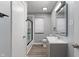 Well-lit bathroom featuring a shower, vanity, mirror, and modern fixtures at 3735 Marrison Pl, Indianapolis, IN 46205