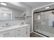 A stylish bathroom featuring double sinks, quartz countertops, and a frameless glass shower at 3735 Marrison Pl, Indianapolis, IN 46205