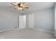 Bright bedroom features neutral walls, carpet, a ceiling fan and two closets at 3735 Marrison Pl, Indianapolis, IN 46205