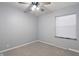 Neutral bedroom featuring a ceiling fan, carpet floors, and a window allowing natural light at 3735 Marrison Pl, Indianapolis, IN 46205