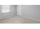 Bright bedroom with neutral carpet, two windows, and fresh paint at 3735 Marrison Pl, Indianapolis, IN 46205
