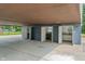 Spacious carport featuring multiple entry doors and overhead lighting at 3735 Marrison Pl, Indianapolis, IN 46205