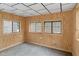 Enclosed porch with wood paneling and view to the home exterior at 3735 Marrison Pl, Indianapolis, IN 46205