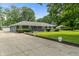 Beautiful ranch home with long driveway and landscaped front yard at 3735 Marrison Pl, Indianapolis, IN 46205