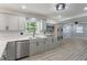 Updated kitchen showcases modern gray cabinets, stainless steel appliances, and light countertops at 3735 Marrison Pl, Indianapolis, IN 46205