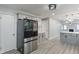 This kitchen features sleek stainless steel appliances, and gray cabinets, all complemented by modern finishes at 3735 Marrison Pl, Indianapolis, IN 46205