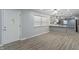 Spacious entryway with kitchen view, featuring gray cabinets and bar seating at 3735 Marrison Pl, Indianapolis, IN 46205
