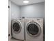 Laundry room featuring two appliances against gray walls and light flooring at 3735 Marrison Pl, Indianapolis, IN 46205