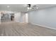 Open-concept living area with gray walls and view of the kitchen at 3735 Marrison Pl, Indianapolis, IN 46205