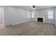 Inviting living room with gray walls, wood floors, and a cozy fireplace at 3735 Marrison Pl, Indianapolis, IN 46205