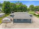 An aerial view of a single-story home showcasing a backyard with concrete parking, accented by a detached structure at 3735 Marrison Pl, Indianapolis, IN 46205