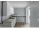 Utility room with updated sink, cabinets, and concrete flooring at 3735 Marrison Pl, Indianapolis, IN 46205