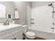 Clean bathroom featuring a white vanity, subway tile shower, and modern fixtures, offering a refreshing and functional space at 3764 Ruckle St, Indianapolis, IN 46205