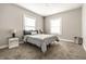 Cozy bedroom with neutral walls, plush carpet, and natural light, creating a serene and inviting atmosphere at 3764 Ruckle St, Indianapolis, IN 46205