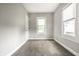Neat bedroom with cozy carpet, great natural light, and neutral tones, offering a serene and comforting atmosphere at 3764 Ruckle St, Indianapolis, IN 46205