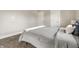 Comfortable bedroom with soft carpet, a well-made bed, and crisp white trim, promoting relaxation and rest at 3764 Ruckle St, Indianapolis, IN 46205