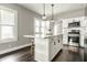 Well-lit kitchen with a spacious island, stainless steel appliances, and ample cabinet space, designed for modern convenience at 3764 Ruckle St, Indianapolis, IN 46205