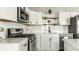 Modern kitchen featuring stainless steel appliances, white cabinets, and sleek countertops, perfect for culinary enthusiasts at 3764 Ruckle St, Indianapolis, IN 46205