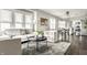 Bright, open-concept living room with plush seating, large windows, and stylish decor, perfect for relaxation at 3764 Ruckle St, Indianapolis, IN 46205