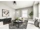 Inviting living room with neutral decor, hardwood floors, and ample natural light, creating an elegant living space at 3764 Ruckle St, Indianapolis, IN 46205