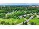 Scenic aerial view of a residential area with lush greenery, well-maintained homes, and quiet streets at 4123 S Village Row, New Palestine, IN 46163