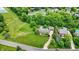 Aerial view of a home with a well-manicured lawn, mature trees, and inviting curb appeal at 4123 S Village Row, New Palestine, IN 46163