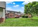 Spacious backyard with a brick home, hot tub, and beautiful lawn at 4123 S Village Row, New Palestine, IN 46163