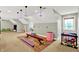 Finished basement offers a play area and an open layout with comfortable seating and plenty of natural light at 4123 S Village Row, New Palestine, IN 46163