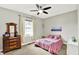 This bedroom has a ceiling fan and plenty of natural light at 4123 S Village Row, New Palestine, IN 46163