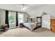 Cozy bedroom with natural light, ceiling fan, and a playful atmosphere at 4123 S Village Row, New Palestine, IN 46163
