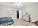 Comfortable bedroom featuring a ceiling fan, carpet floors, and closet for storage at 4123 S Village Row, New Palestine, IN 46163