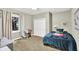 Inviting bedroom offers natural light, carpet floors, and closet for storage at 4123 S Village Row, New Palestine, IN 46163