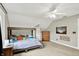 Bedroom with unique wooden frame bed, ceiling fan, and warm ambiance at 4123 S Village Row, New Palestine, IN 46163