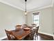 Simple dining room featuring hardwood floors and a window at 4123 S Village Row, New Palestine, IN 46163