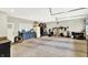 Spacious garage with blue cabinets, storage, and a white door at 4123 S Village Row, New Palestine, IN 46163